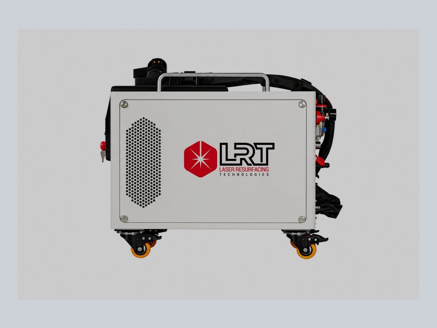 The unit square-on from the side — the LRT logo panel and ventilation grille, with the umbilical, gas fittings and carry strap gathered at the right